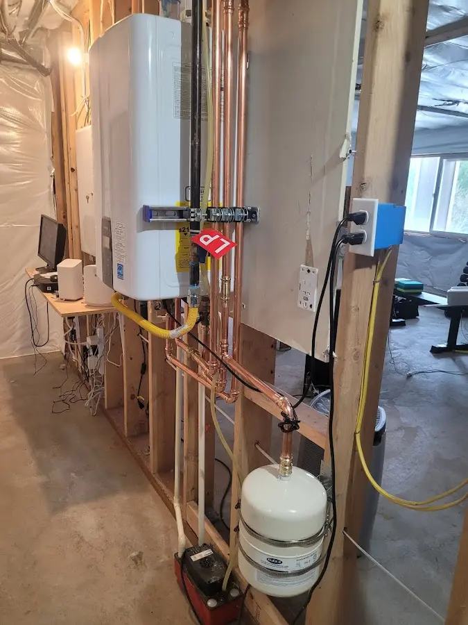Licensed plumber repairing a kitchen sink in International Falls